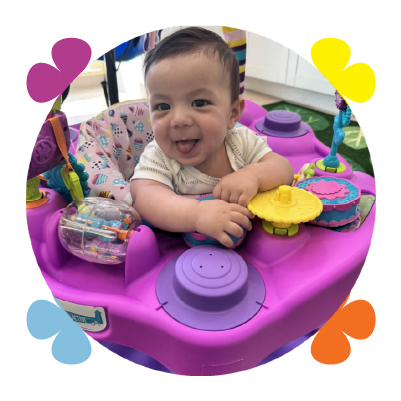Infant exploring sensory toys at Learning Center Live Oak daycare San Antonio