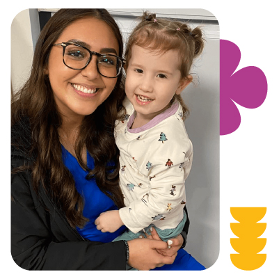 Teacher holding toddler at Learning Center Live Oak building trust and connection