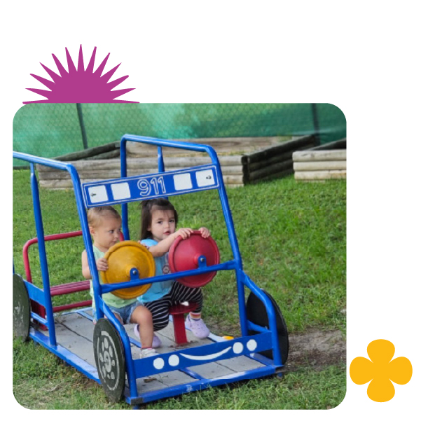 Toddlers engaged in imaginative play at Learning Center Live Oak daycare in San Antonio