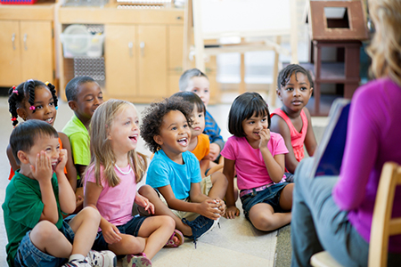 Diverse group of children learning together while choosing a daycare center like Live Oak Bright Beginnings Daycare and Preschool in San Antonio, Texas