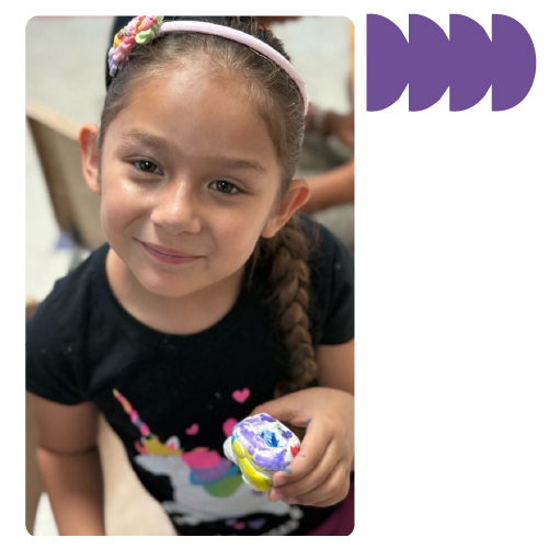 Child participating in creative activity at Learning Center Live Oak after school program