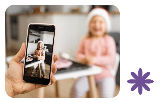 Parent receiving child updates on app from Learning Center Live Oak preschool San Antonio