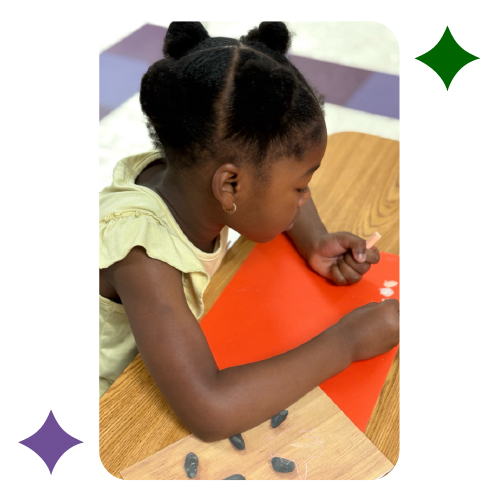 Preschool child working on art activity at Learning Center Live Oak classroom