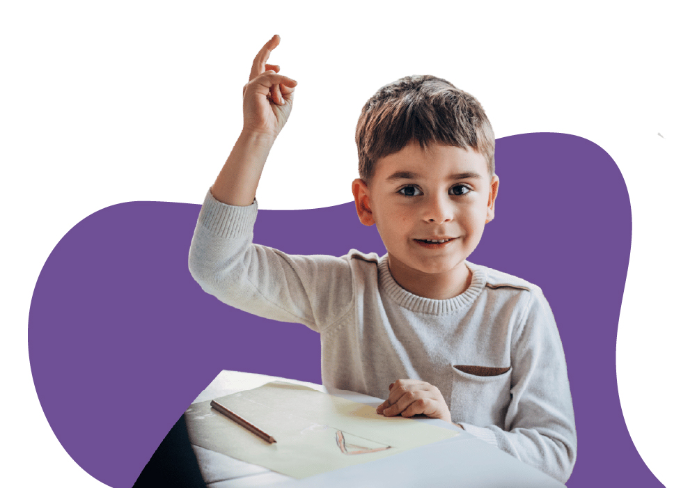 Preschool child raising hand at Learning Center Live Oak classroom San Antonio Texas
